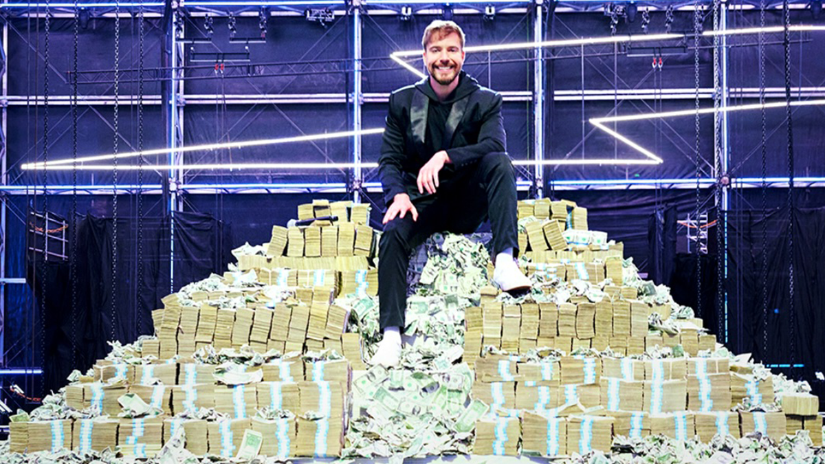 Mr Beast on pile of cash for Beast Games.