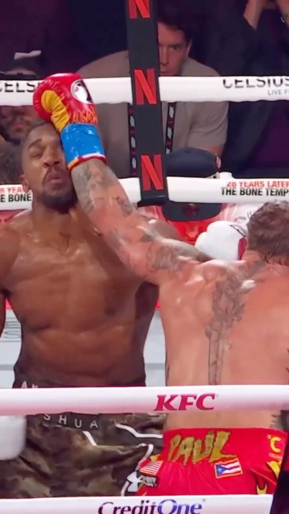 Jake Paul punches Anthony Joshua.